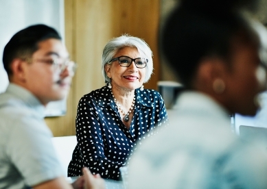 Woman at meeting listening